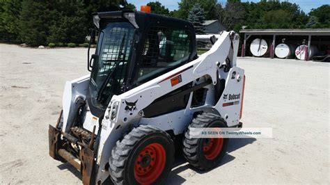 bobcat skid steer blue book values|bobcat s590 value.